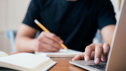 Person at computer completing application © Getty Images